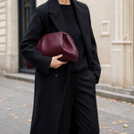 Woman carrying the Everley Pouch Clutch
