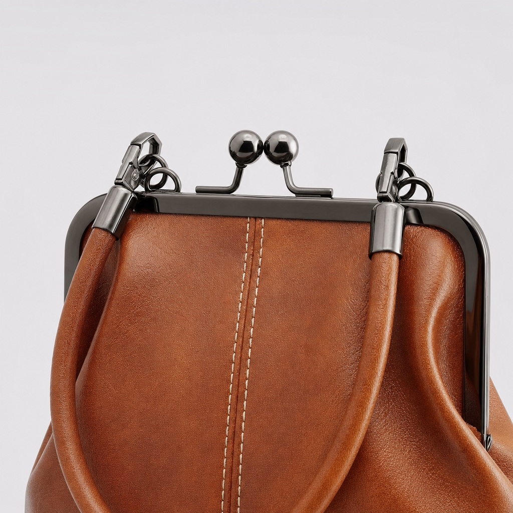 Close-up of the kiss-lock clasp on the Brackley Frame Bag
