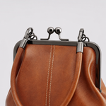 Close-up of the kiss-lock clasp on the Brackley Frame Bag
