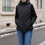 Marchmont Hooded Quilted Jacket in black worn with jeans, front view