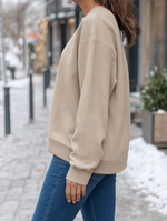 Woman wearing the Radnor Fleece Sweatshirt, side view